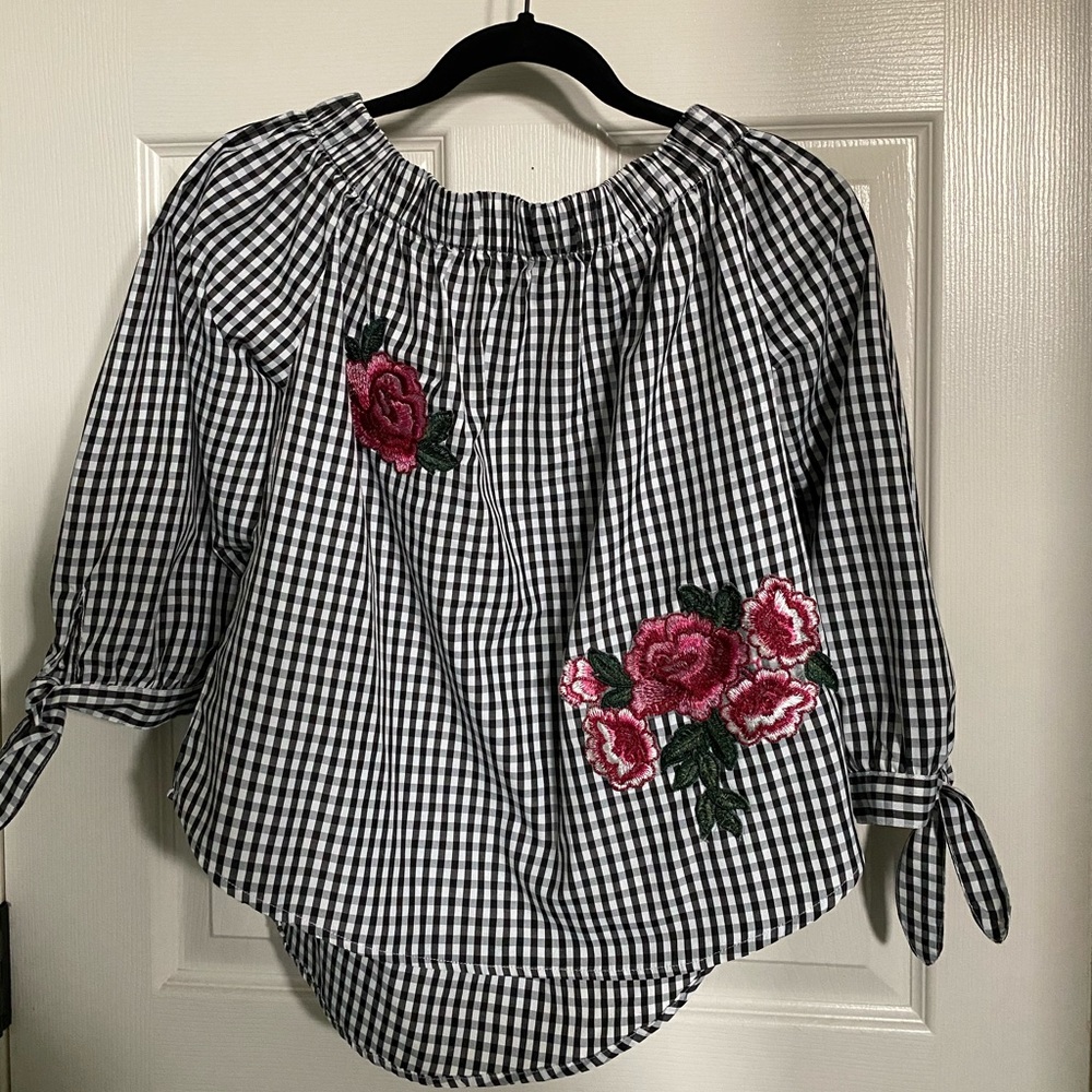 Cute black and white off the shoulder blouse.